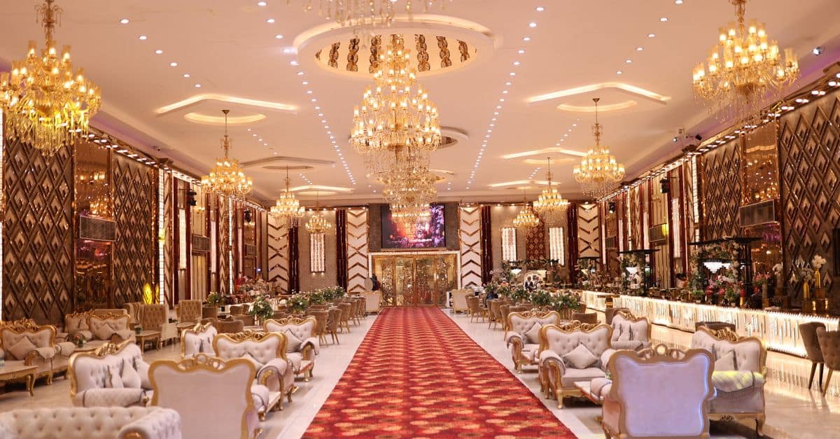 Elegant wedding hall with luxurious chandeliers and classic decor, perfect for special events.
