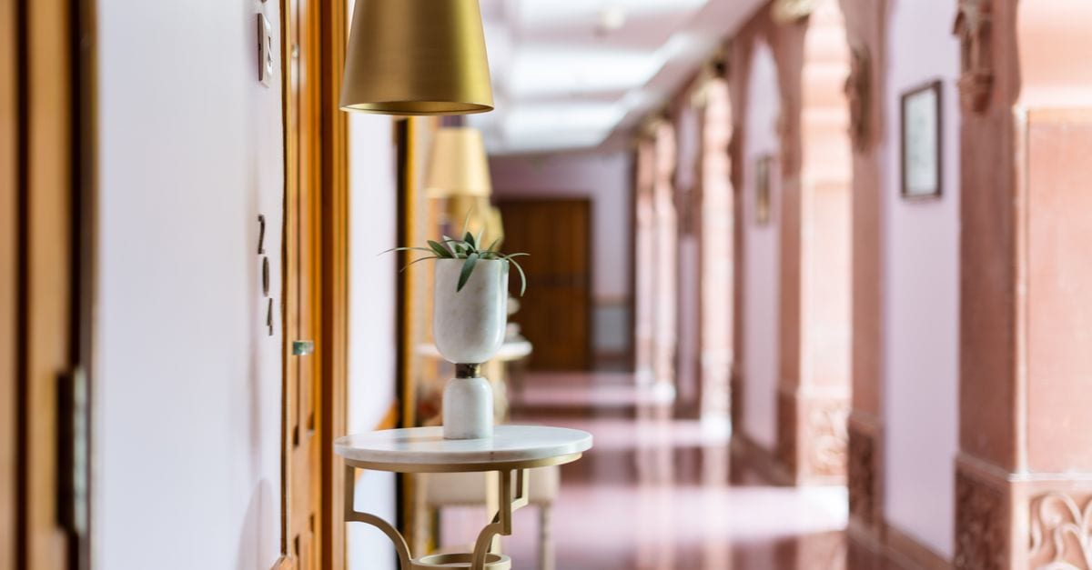 Elegant corridor of a heritage hotel in Bikaner, showcasing Indian architectural charm and luxury design.
