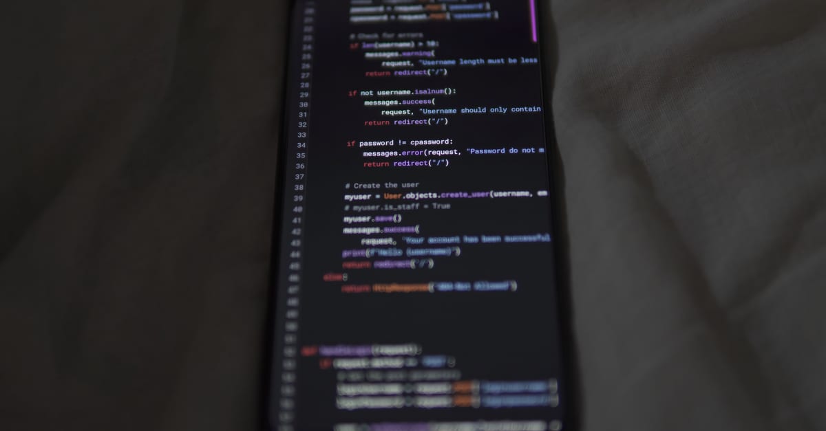 Close-up of a smartphone showing Python code on the display, showcasing coding and technology.